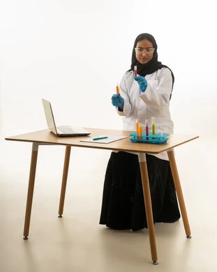 Saudi Female Scientist Working with Test Tubes in Lab