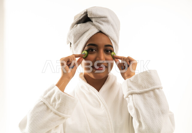 Saudi Woman Skincare Routine with Cucumber Slices