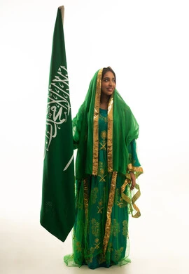 Saudi Woman in Traditional Dress with Saudi Flag