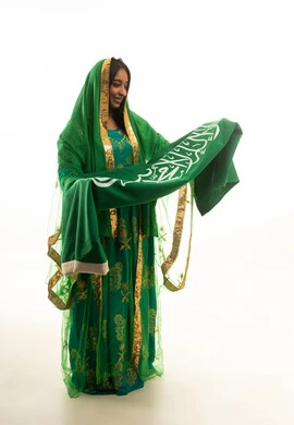 Saudi Woman in Green Heritage Dress with National Flag