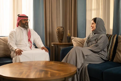 Saudi Couple Talking in Modern Living Room