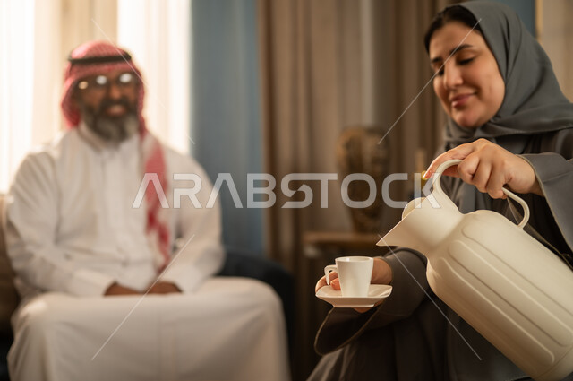 Saudi Woman Pouring Arabic Coffee in Traditional Setting