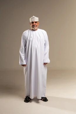 Omani Man in Traditional Dress Standing in Studio