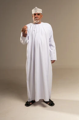 Elderly Omani Man in Traditional Dishdasha and Kumma