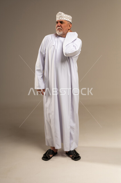 Elderly Omani Man with Neck Pain in Studio