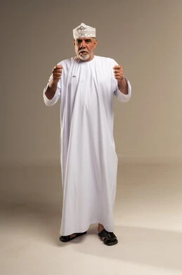 Elderly Omani Man in Traditional Dishdasha and Kumma