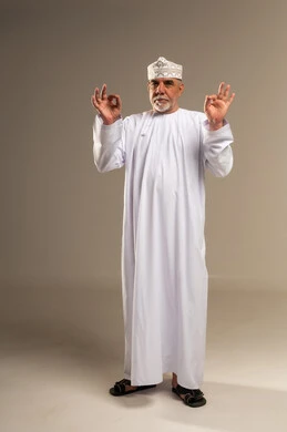 Omani Man in White Dishdasha Giving Okay Sign