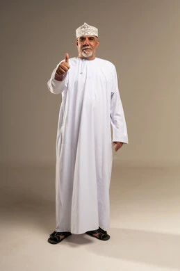 Elderly Omani Man Giving Thumbs Up in Studio