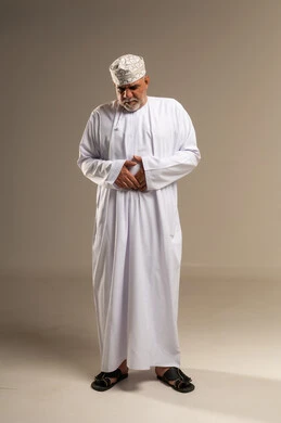 Elderly Omani Man with Stomach Pain in Studio