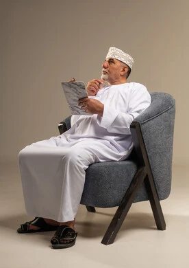 Omani Senior Man with Tablet in Studio Setting