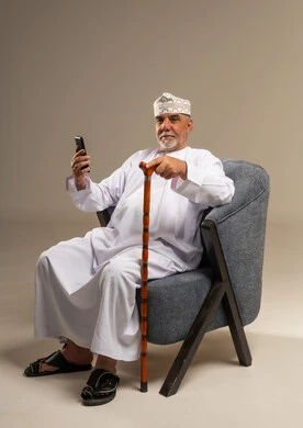 Senior Omani Man with Smartphone in Studio