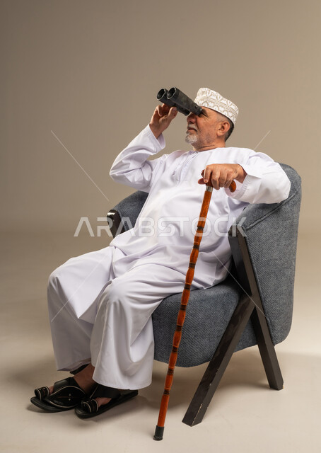 Omani Senior Man Looking Through Binoculars