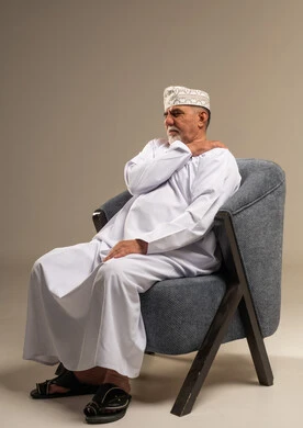 Elderly Omani Man with Shoulder Pain in Studio