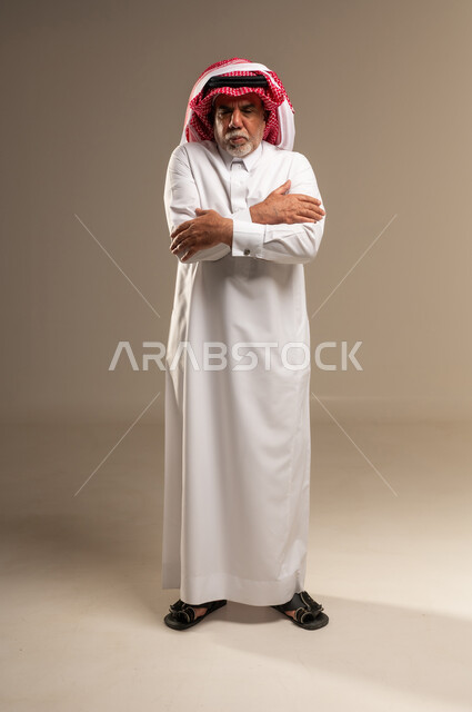 Elderly Saudi Man Shivering in Studio Background