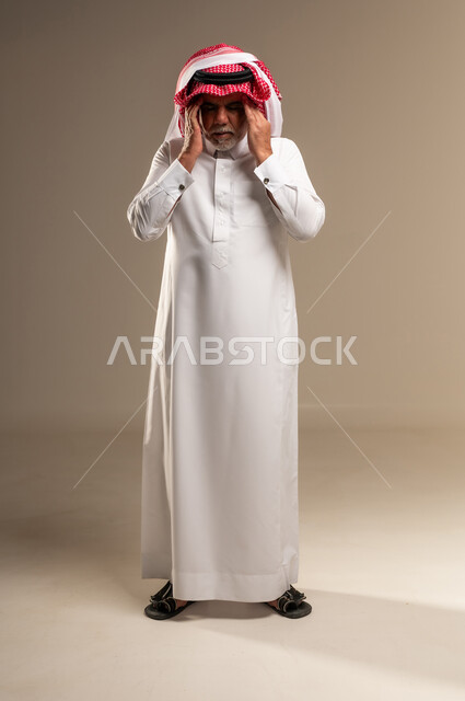 Elderly Saudi Man with Headache in Studio