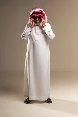 Elderly Saudi Man with Headache in Studio