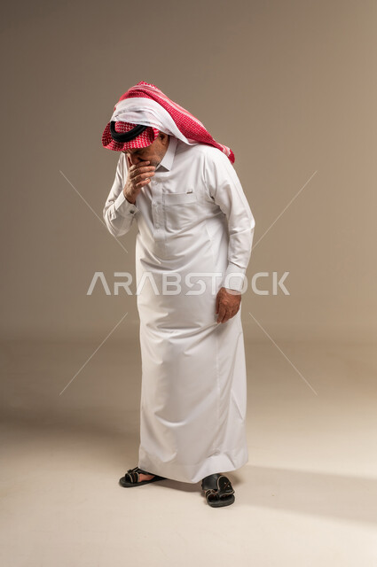 Sick Elderly Saudi Man Coughing in Traditional Attire