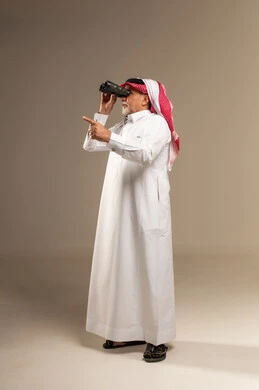 Senior Saudi Man with Binoculars in Studio