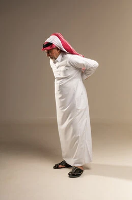Elderly Saudi Man with Back Pain in Studio Elderly Saudi Man with Back Pain in Studio