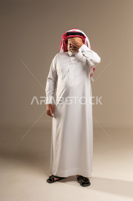 Elderly Saudi Man Expressing Stress in Studio Shot