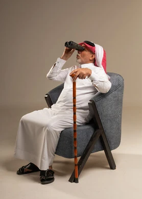 Saudi Senior Man with Binoculars and Walking Stick