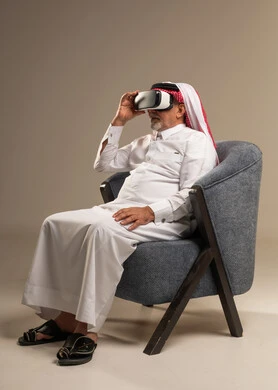 Saudi Senior Man Using VR Headset in Studio