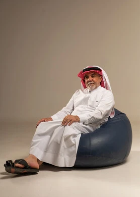 Senior Saudi Man Sitting on Beanbag in Studio
