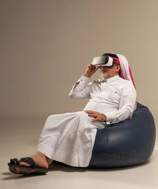 Senior Saudi Man Wearing Virtual Reality Headset in Studio