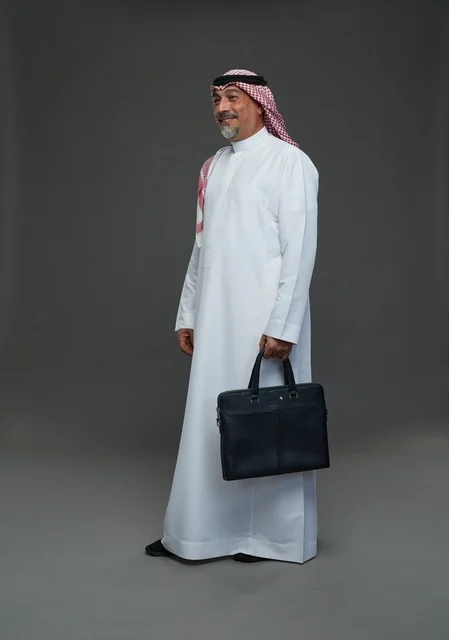 A Saudi Arabian Gulf businessman wearing a white thobe and a shemagh, carrying a laptop bag, with various gestures and signals, full body, gray background.