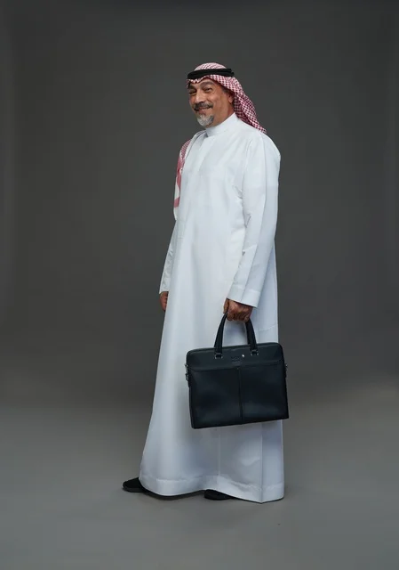 A Saudi Arabian Gulf businessman wearing a white thobe and a shemagh, carrying a laptop bag, with various gestures and signals, full body, gray background.