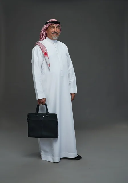A Saudi Arabian Gulf businessman wearing a white thobe and a shemagh, carrying a laptop bag, with various gestures and signals, full body, gray background.