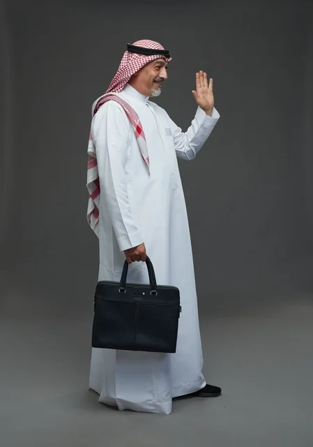 A Saudi Arabian Gulf businessman wearing a white thobe and a shemagh, carrying a laptop bag, with various gestures and signals, full body, gray background.
