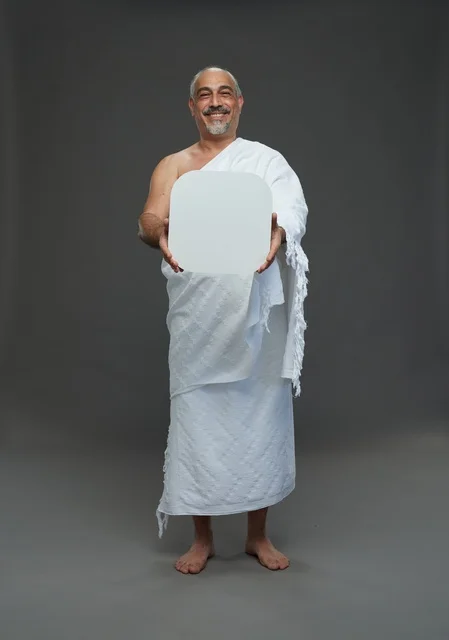 A portrait of a Saudi pilgrim in Ihram clothing holding a blank white square board while performing the rituals, with various gestures and signs, full body, gray background.