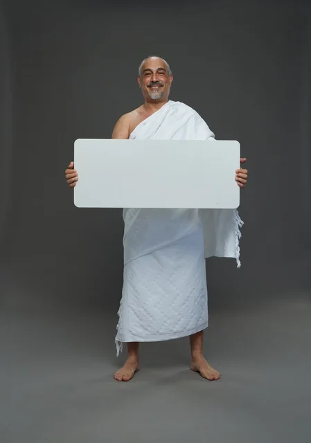 A portrait of a Saudi pilgrim in Ihram clothing holding a blank white square board while performing the rituals, with various gestures and signs, full body, gray background.