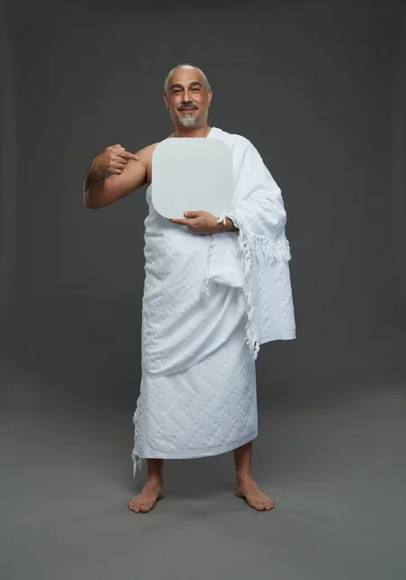 A portrait of a Saudi pilgrim in Ihram clothing holding a blank white square board while performing the rituals, with various gestures and signs, full body, gray background.