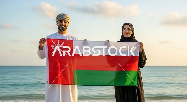 الاحتفال بالأعياد والمناسبات الوطنية, حب الوطن والانتماء إليه، إمرأة عربية خليجية عمانية ترتدي الحجاب والعباءة تمسك علم السلطنة برفقة زوجها، الاحتفال بذكرى اليوم الوطني العماني 18 نوفمبر، إحياء ذكرى تأسيس الدولة 1775 م، الاعتزاز والفخر بالرموز والراية