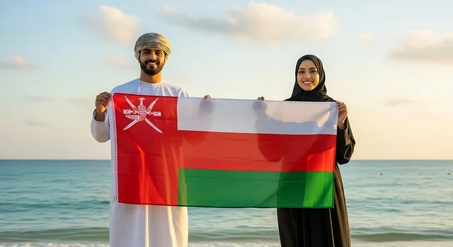 Celebrating national holidays and occasions, love for the homeland and belonging to it, an Arab Gulf Omani woman wearing a hijab and abaya holding the flag of the Sultanate alongside her husband, celebrating the anniversary of Oman's National Day on November 18, commemorating the founding of the state in 1775 AD, pride and honor in the symbols and the flag.