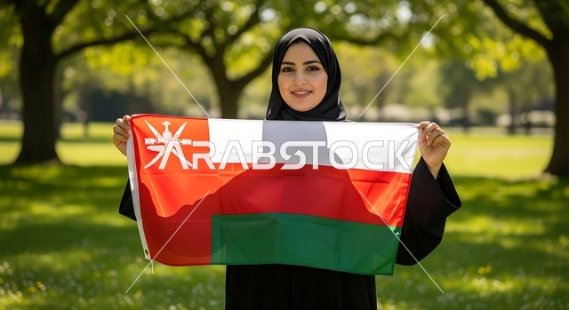Celebrating holidays and national occasions, love for the homeland and belonging to it, an Arab Gulf Omani woman wearing a hijab and abaya holding the flag of the Sultanate, the anniversary of Oman's National Day on November 18, commemorating the founding of the state in 1775 AD, pride and honor in the symbols and the flag.
