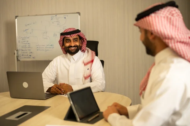 Workshops and training, exchanging experiences and ideas, studying and analyzing new projects, using modern technical devices, unity and teamwork, developing work and solving problems, holding a meeting for a team of Saudi Gulf Arab workers inside the company headquarters, a Saudi office profession and job.