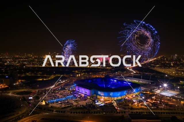 تصوير درون جوي لملعب الأول بارك في مدينة الرياض، المملكة العربية السعودية، منشأة رياضية حديثة متعددة الاستخدامات، المباريات والفعاليات الرياضية الكبرى، تصميم معماري عصري ومرافق متطورة، وجهة رياضية وترفيهية بارزة في العاصمة.