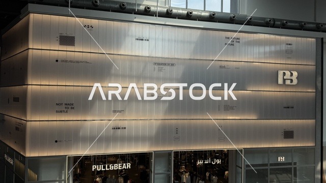 A local shopping center in the Yew Walk area of Jeddah, Saudi Arabia, on February 15, 2024, featuring international and local restaurants and cafes, a comprehensive urban destination for walking, entertainment, and shopping, diverse brands, seasonal events, and recreational activities, with a vibrant family and youth atmosphere.