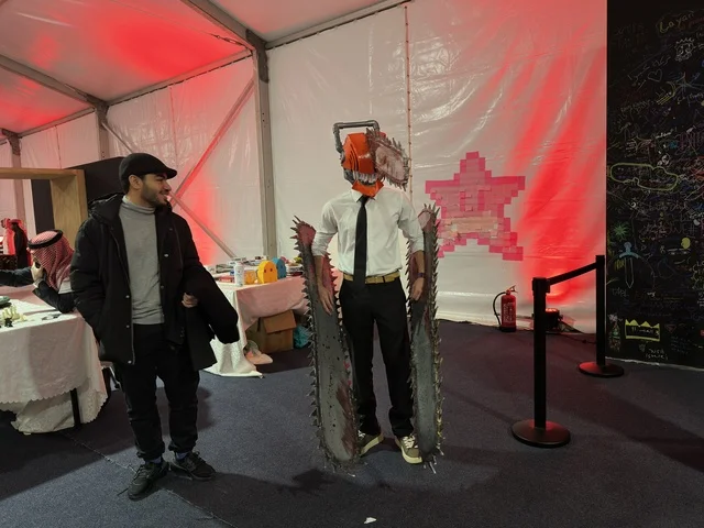 A man wearing a costume at the Gaming Plus (+) event at King Fahd University of Petroleum and Minerals in Dhahran, Eastern Province, Saudi Arabia, on January 28, 2026, a digital entertainment experience dedicated to video game enthusiasts, featuring game competitions and challenges, modern devices and technologies, wide youth participation, and an exciting atmosphere that combines entertainment and technology.