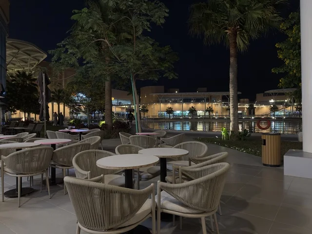 A complete entertainment and commercial landmark, a café in The Move complex in the city of Jubail Industrial in the Eastern Province, Jubail Corniche, a vibrant atmosphere for the year 2025.