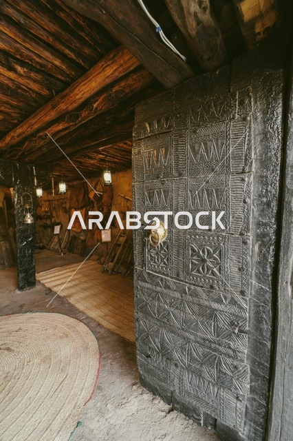 A massive iron door, the historic Al-Masmak Palace Museum in the city of Riyadh, Saudi Arabia, historical landmarks of Riyadh, the heritage Al-Masmak Palace, ancient architecture, archaeological tourist sites in Saudi Arabia.