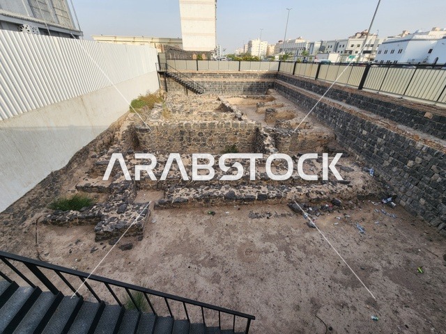 The mosque was completely rebuilt and expanded during the reign of King Fahd, the first Friday prayer held after the migration, exposed stone foundations at an excavation site, Kingdom of Saudi Arabia, Medina, Friday Mosque, one of the most prominent historical landmarks associated with the Prophet's biography.