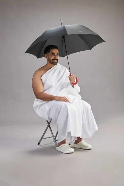 Saudi Muslim Pilgrim in Ihram with Umbrella Studio