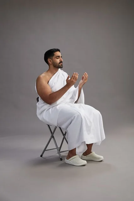 Saudi Pilgrim in Ihram Praying in Studio