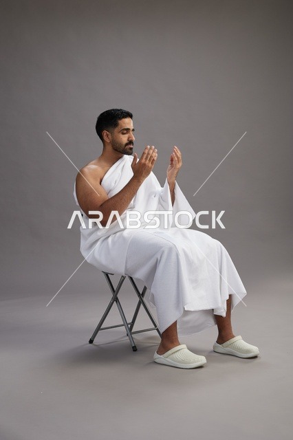 Saudi Pilgrim in Ihram Praying in Studio