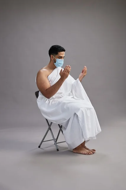 Saudi Man in Ihram Praying with Face Mask Studio