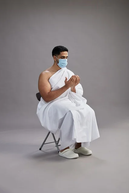 Saudi Man in Ihram Wearing Mask Praying in Studio